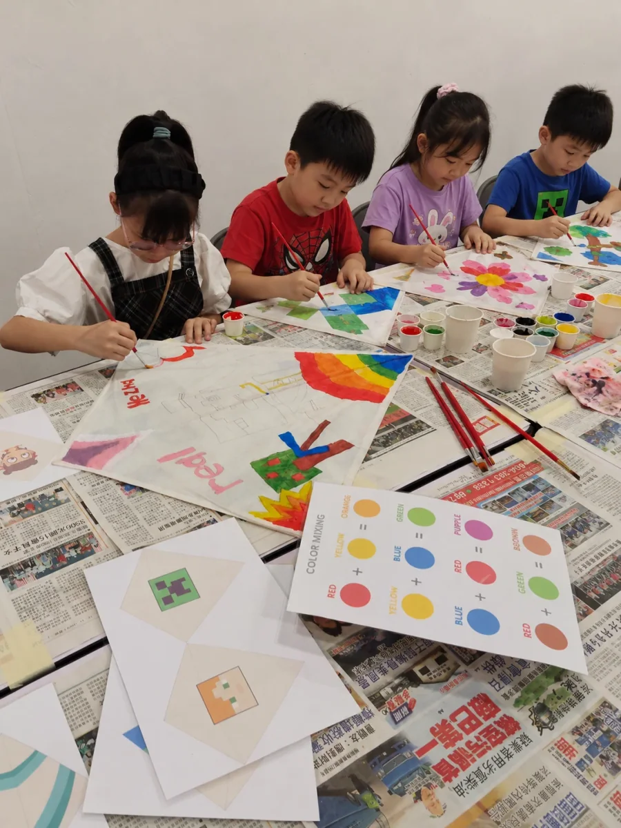 Children learning and creating together during a craft activity