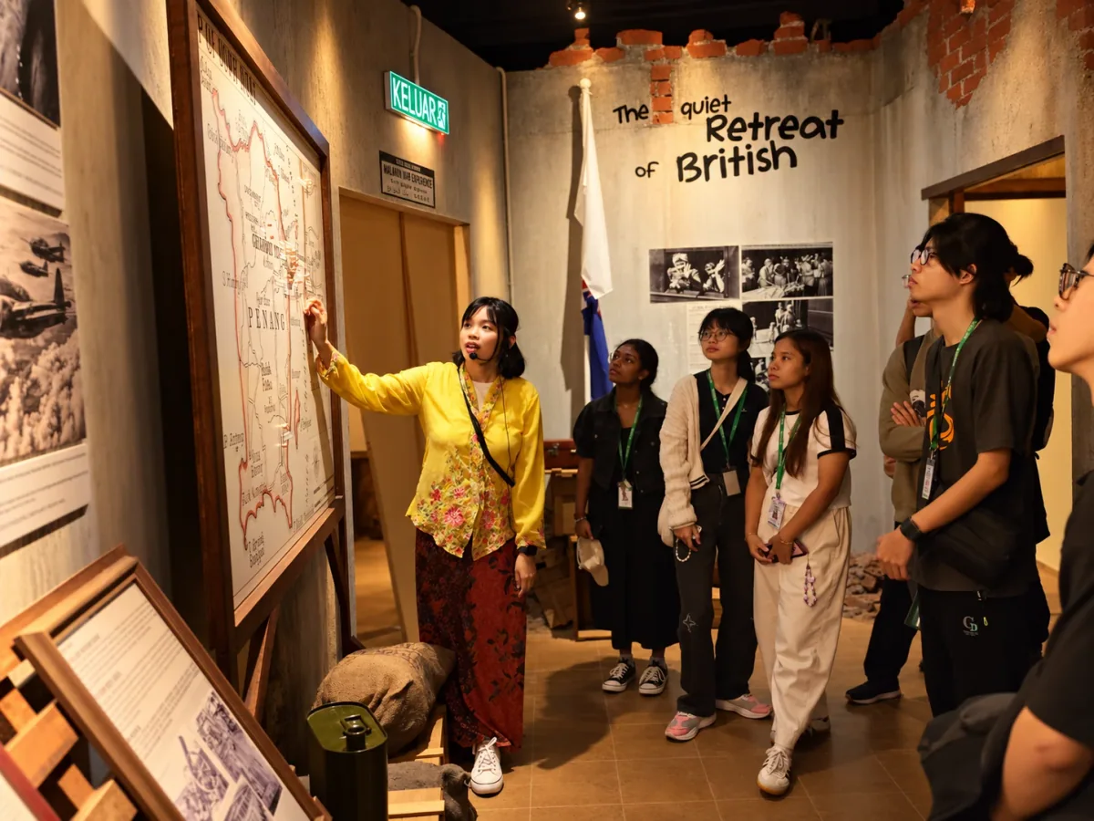 A guide explaining a historical scene